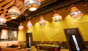 Carved clay "world map" finish. Nando's restaurant in Gatwick, South Terminal. Courtesy of Nando's