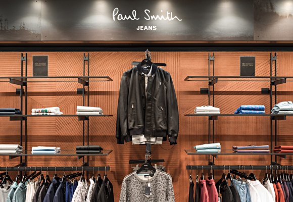 Paul Smith store in Harrods, London. Geometric pattern on smooth clay wall