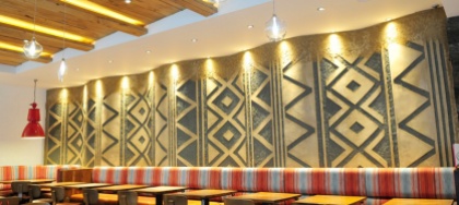 Carved clay wall, geometric pattern, Nando's restaurant in Gloucester