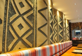 Carved clay wall, geometric pattern, Nando's restaurant in Gloucester