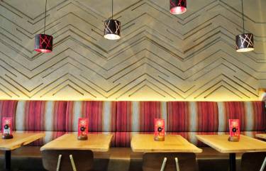 Carved clay wall, multiple colours, geometric pattern, Nando's restaurant in Hamilton