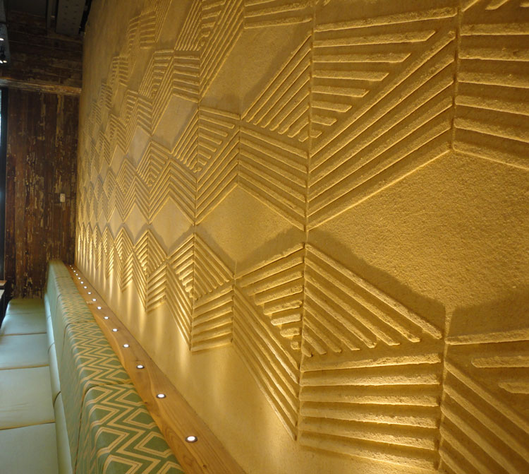 Anaglyptic clay textured wall, Nando's restaurant in Manchester