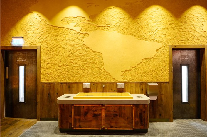 Carved clay "world map" finish. Nando's restaurant in Gatwick, South Terminal. Courtesy of Nando's